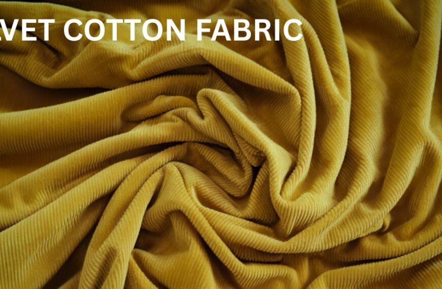 Close-up of mustard-yellow velvet cotton fabric draped in soft folds.