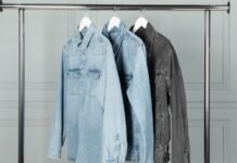 Denim Overshirt Jacket for Effortless Everyday Style Three denim jackets hanging on a metal clothing rack.