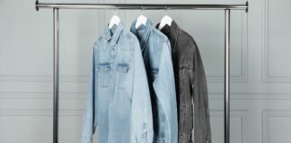Denim Overshirt Jacket for Effortless Everyday Style Three denim jackets hanging on a metal clothing rack.
