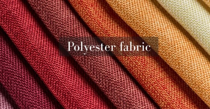 Close-up of folded polyester fabric in warm autumn shades, including burgundy, rust, and tan, with a soft textile texture visible. Flame Retardant Polyester