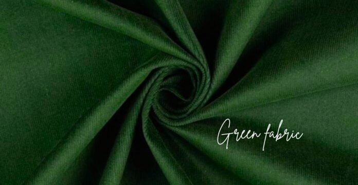 A close-up shot of rich, dark green fabric folded into swirling pleats, creating a soft, luxurious texture. The words 