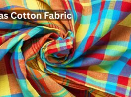 Close-up of colorful Madras cotton fabric with a plaid pattern, twisted into folds.