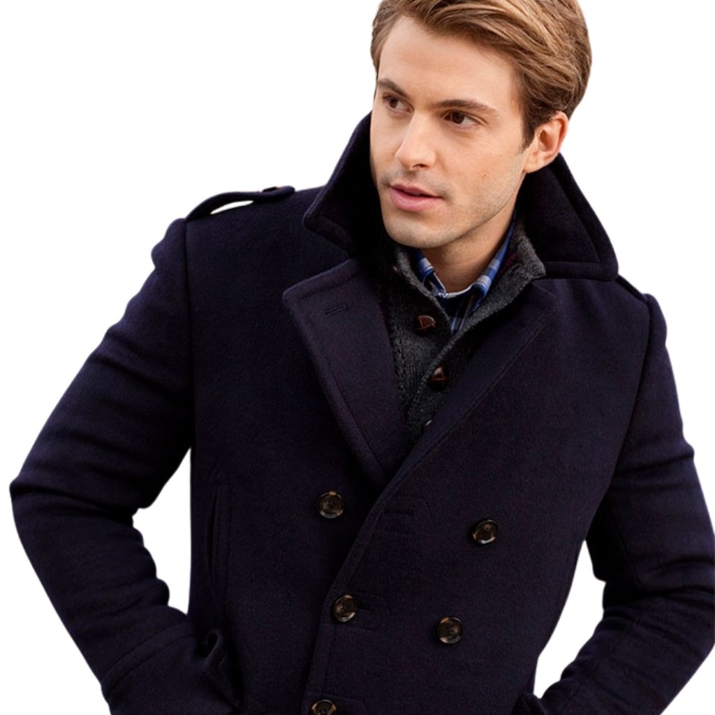 Topcoat Jackets Stylish Outerwear for a Sharp Seasonal Look 14 A man posing in a navy double-breasted pea coat with a high collar, looking to the side.
