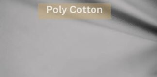 What is Poly Cotton Fabric? What to know before buying A close-up image of smooth poly cotton What Is Poly Cotton Fabric?fabric with a beige label reading “Poly Cotton,” illustrating textile texture for discussing topics like does polyester make you sweat'what is poly cotton fabric
