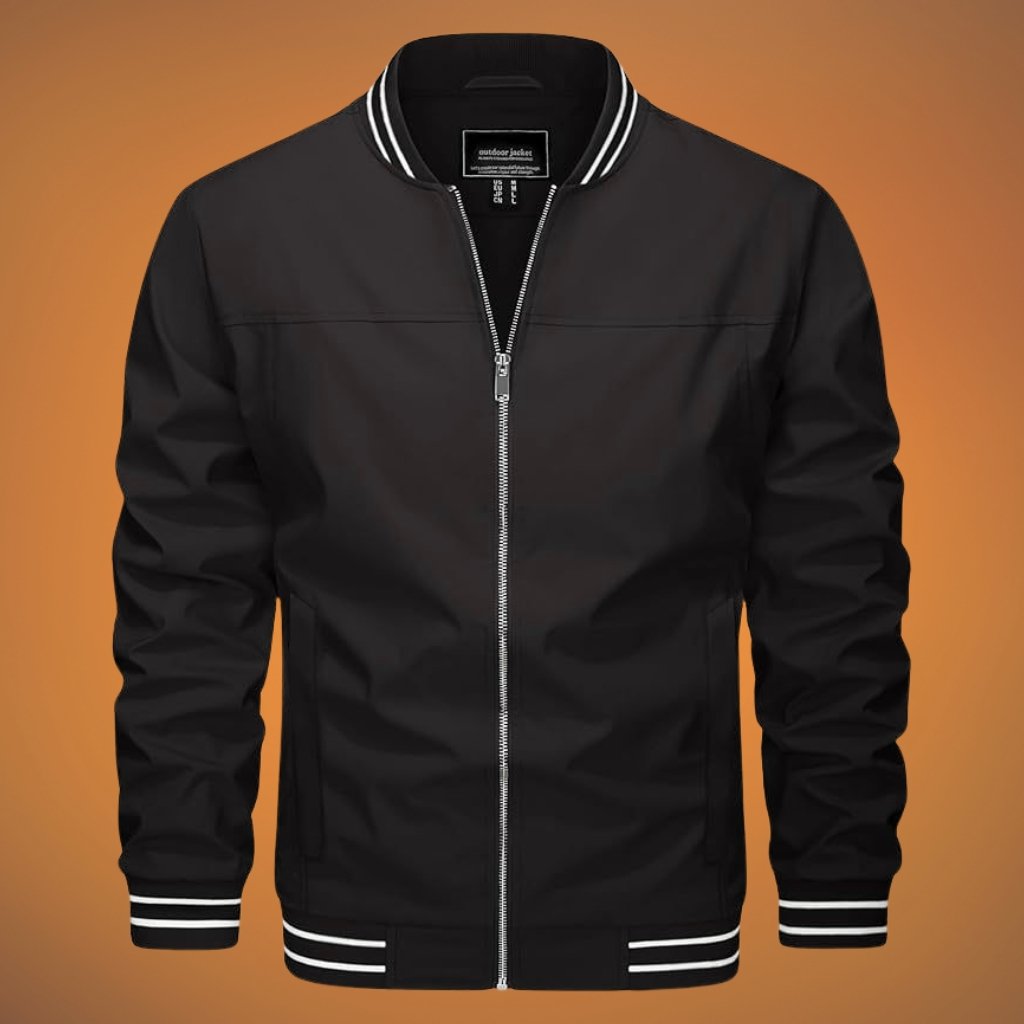 Black varsity-style jacket with a silver front zipper, white-striped ribbed collar, cuffs, and hem, shown against an orange gradient background.
