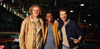 Top Track Jackets: Style, Comfort, and Performance Combined Three smiling young men standing together indoors at a recreation venue, arms around each other. Track Jackets