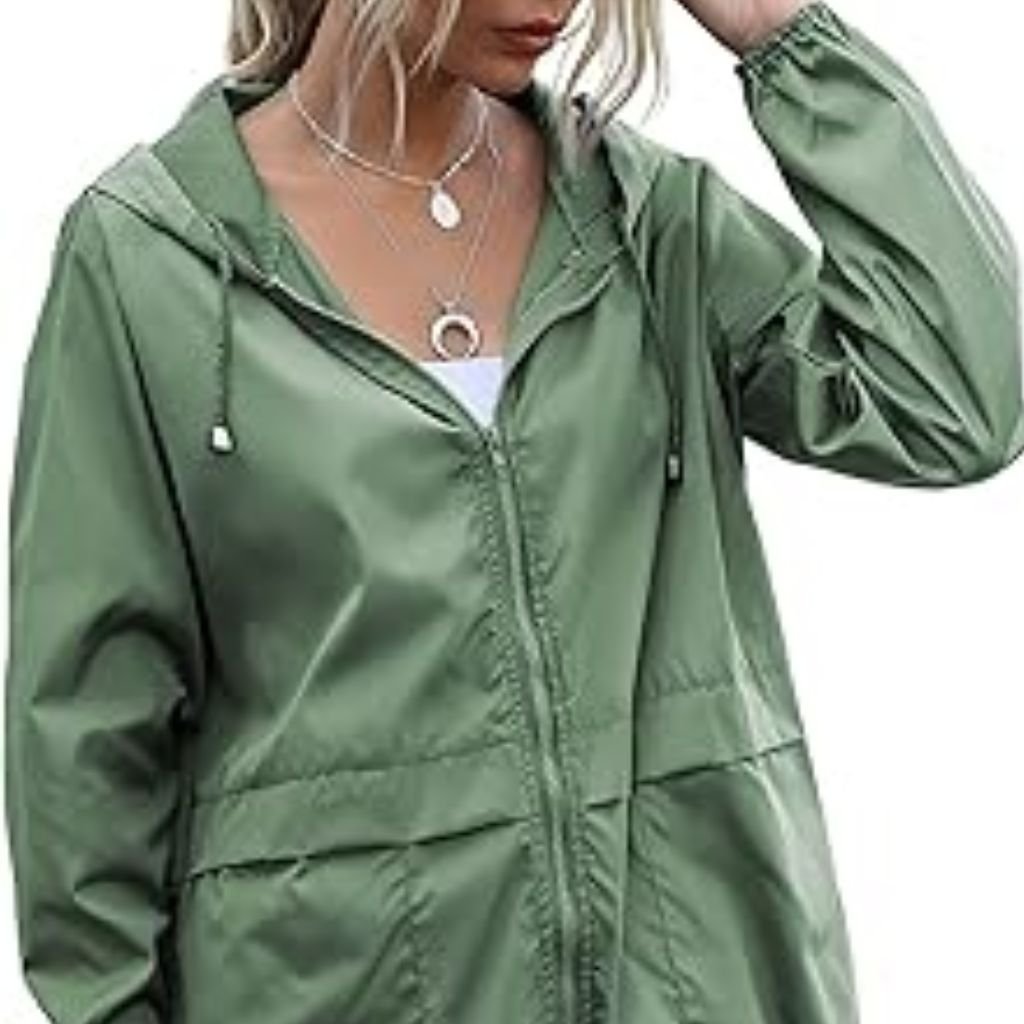 Waterproof or Water-Resistant Puffers: What You Should Know 18 A man wearing a color-blocked puffer jacket with a beige hood and shoulders, green body, and black sleeves, standing against a plain white background.