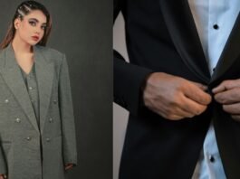 A woman wearing an oversized grey double-breasted blazer stands confidently, while next to her a man buttoning a black tuxedo jacket is shown in a close-up.Tuxedo Jacket