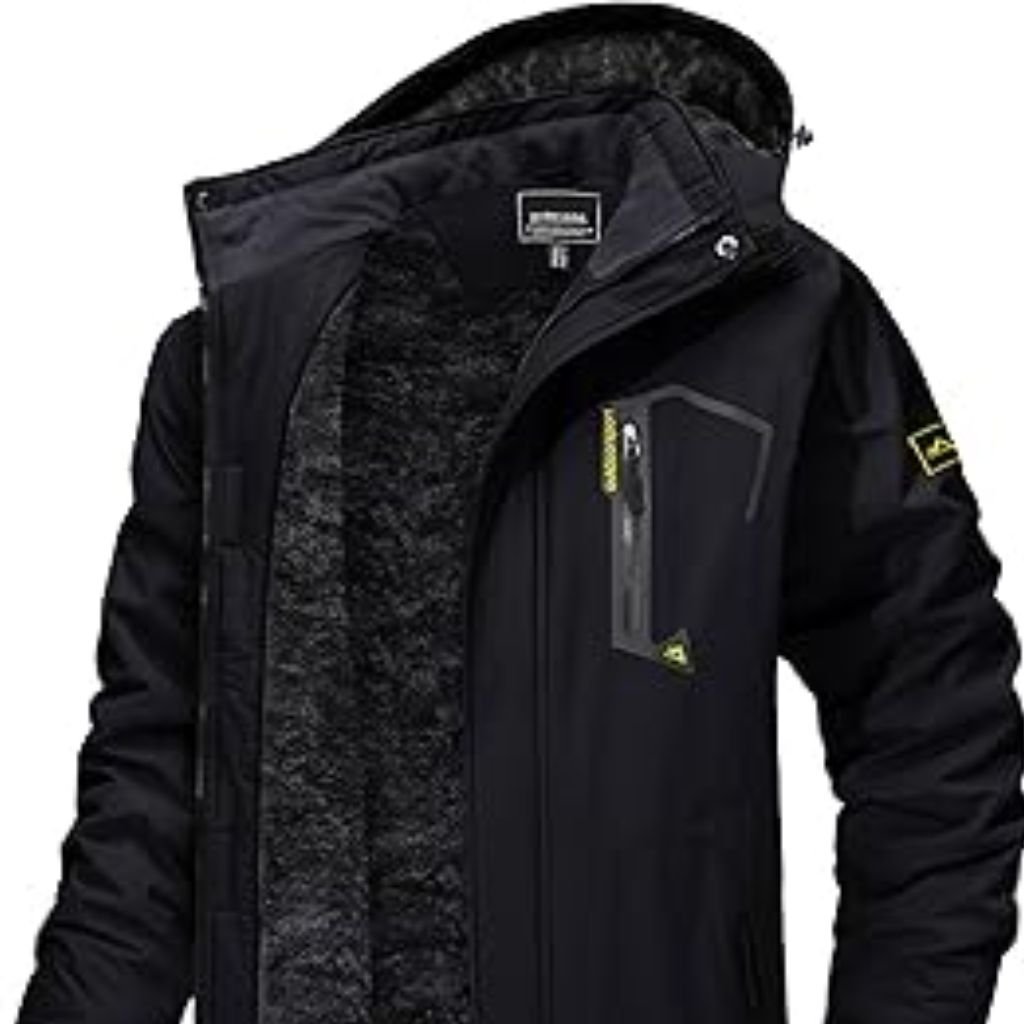 Waterproof or Water-Resistant Puffers: What You Should Know 14 A man wearing a color-blocked puffer jacket with a beige hood and shoulders, green body, and black sleeves, standing against a plain white background.Waterproof or Water-Resistant Puffers