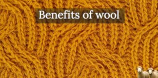 Top 10 Benefits of Wool: Nature’s Smart Fiber Close-up of thick orange wool yarn with a header text overlay that reads ‘Benefits of wool’ and a small group of sheep in the bottom right corner.