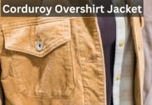Corduroy Overshirt Jackets: A Stylish Layer for Every Season Close-up of a tan corduroy overshirt jacket with a flap pocket and button, layered over a dark knit and a plaid shirt.