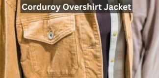 Corduroy Overshirt Jackets: A Stylish Layer for Every Season Close-up of a tan corduroy overshirt jacket with a flap pocket and button, layered over a dark knit and a plaid shirt.
