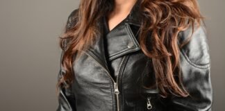 Moto Biker Jacket: Sleek Style with Modern Road Attitude Moto Close-up of a black leather moto biker jacket with silver zippers and a folded lapel.