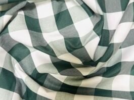 "Green and white checked textile showing texture and weave, illustrating what is poplin fabric."