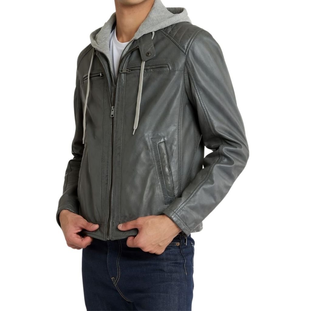 Hooded Leather Jacket: Perfect Blend of Fashion and Function 7 A gray leather hooded jacket with a light gray hoodie layered underneath, worn by a man in dark jeans.