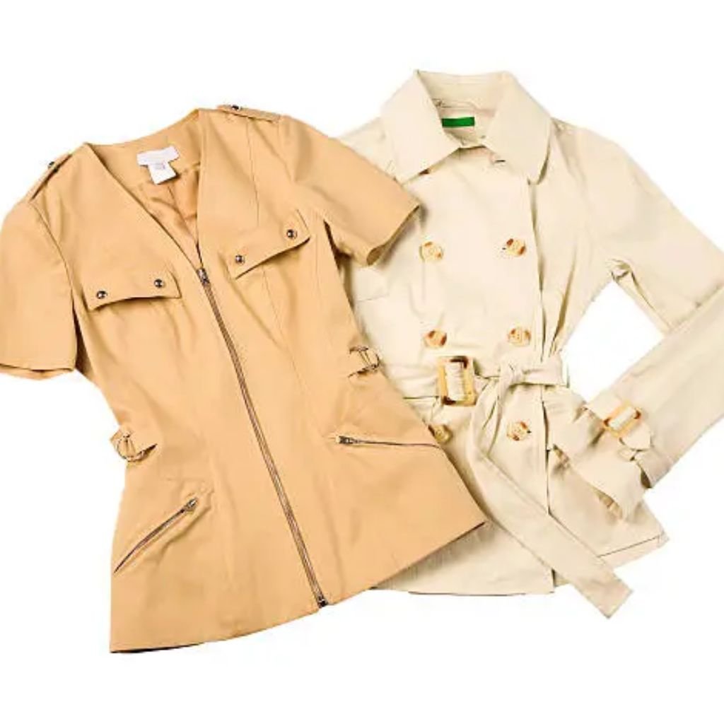 Person wearing a green puffer jacket and sunglasses stands on a snowy path with people walking behind them among snow-covered trees.Military-Inspired Winter Jackets (6)