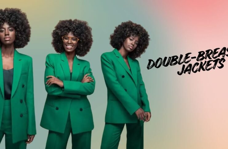 Three women wearing green double-breasted jackets styled in modern tailored suits against a soft gradient background.Double-Breasted Wool Jackets: