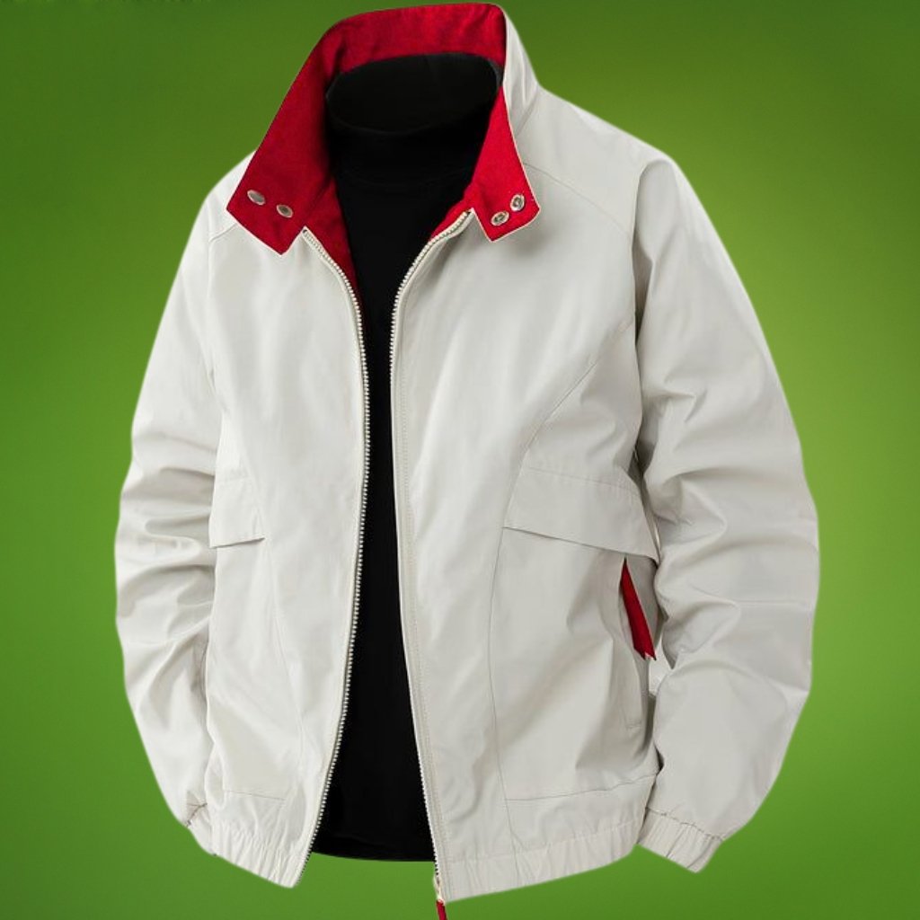 Light-colored zip-front jacket with a red inner collar, black inner layer, and red accents on the zipper pulls and pocket edge, displayed on a mannequin against a green background.