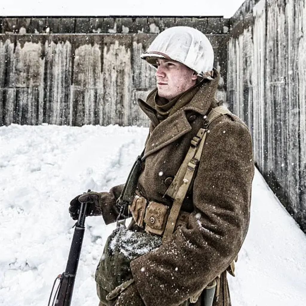 Two women wearing belted winter coats, one in a brown hooded parka and the other in a long taupe belted puffer coat, styled for cold weather.Belted Winter Coats