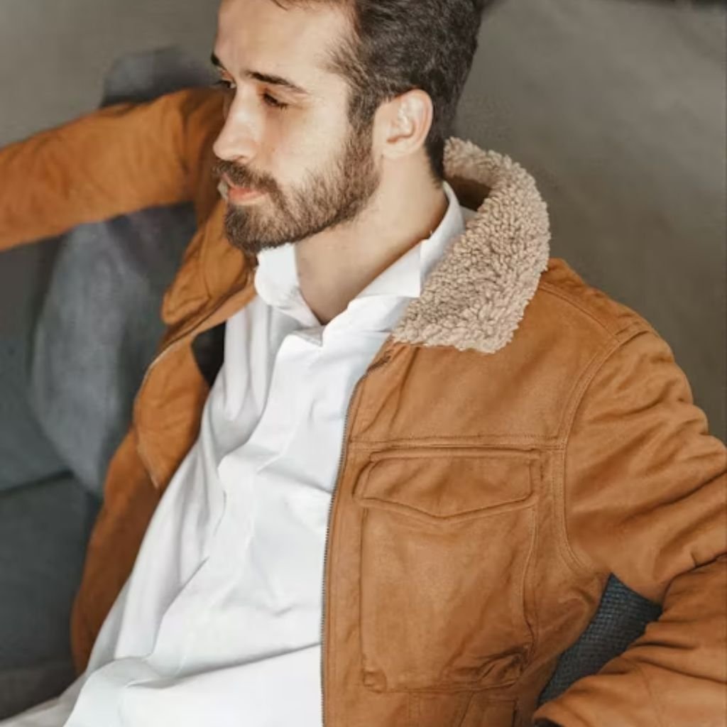 Man wearing a brown jacket with a soft collar over a white shirt, showcasing breathable winter fashion while exploring does polyester make you sweat.Boiled Wool Jacket