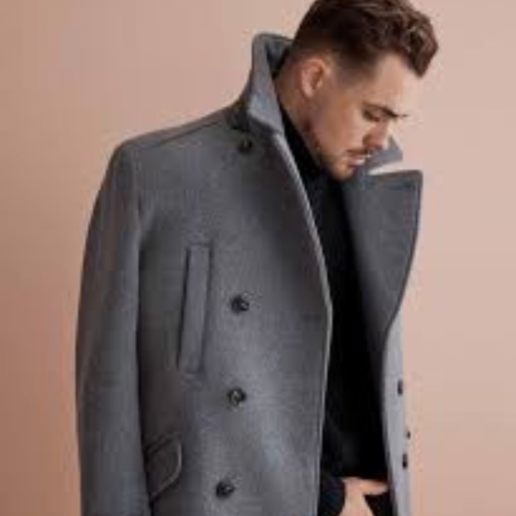 Two people standing close together outdoors, seen from behind, wearing patterned and pink shirts with trees in the background.Double-Breasted Wool Jackets: