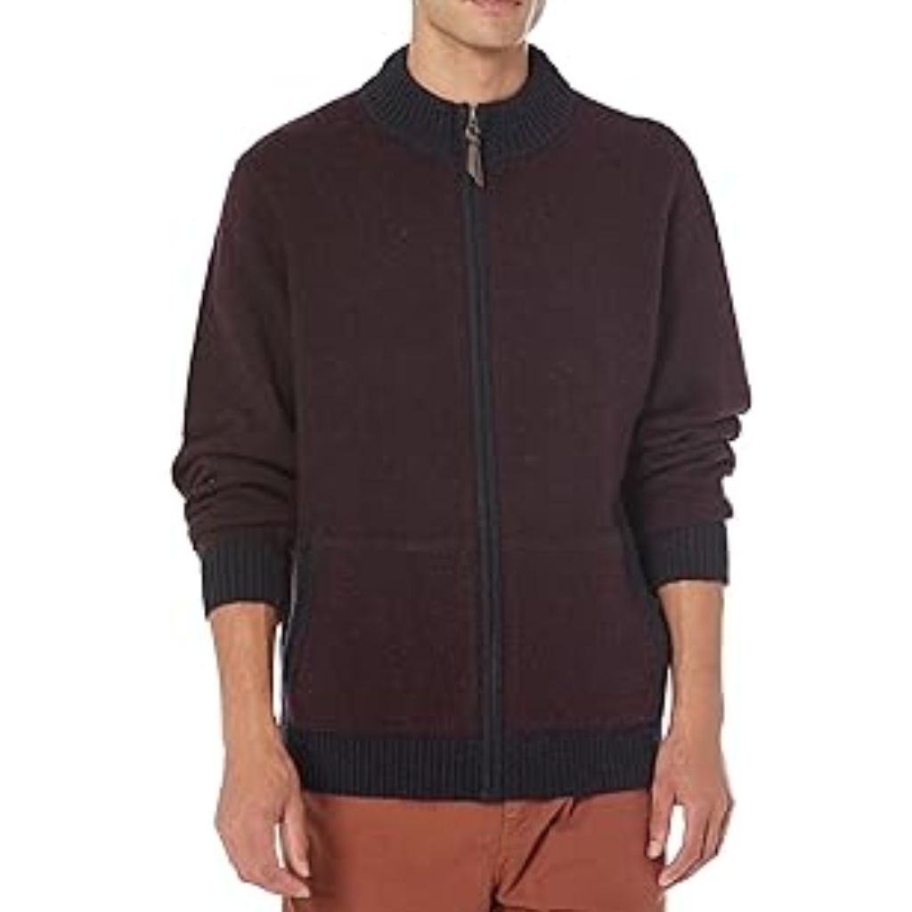 Man wearing a dark brown zip-up knit sweater with a ribbed collar, cuffs, and hem, styled casually over trousers.Does Shetland Wool Itch?