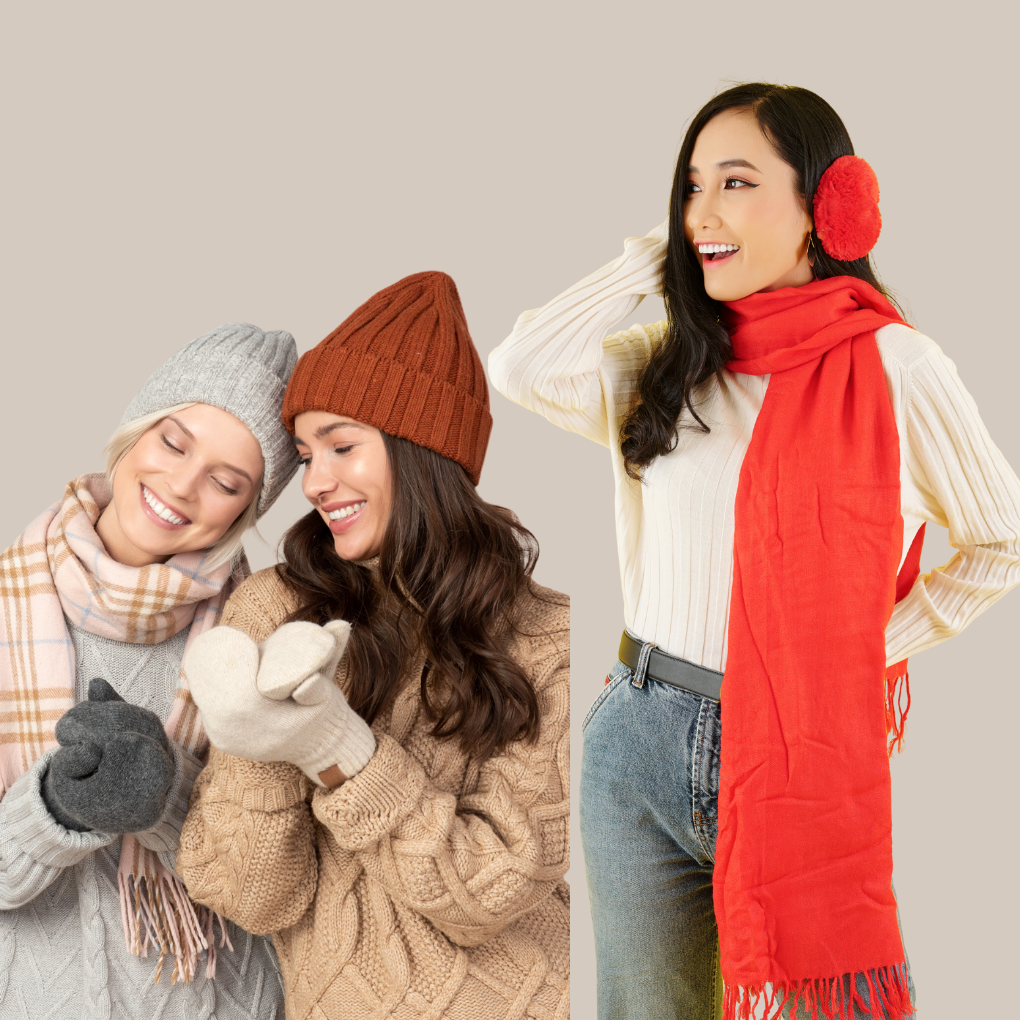 Three women wearing winter clothing: two women on the left are smiling, wearing knit hats and scarves; the woman on the right stands with a red scarf and red earmuffs, looking to the left with a cheerful expression.
