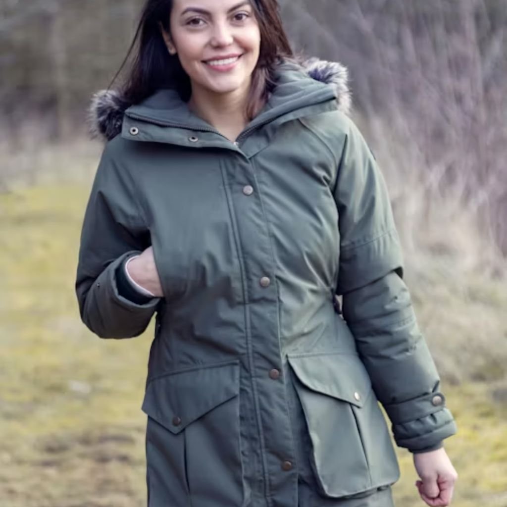Woman wearing a bright pink lightweight down jacket, styled for warmth and comfort in cool weather.Lightweight Down Jacket