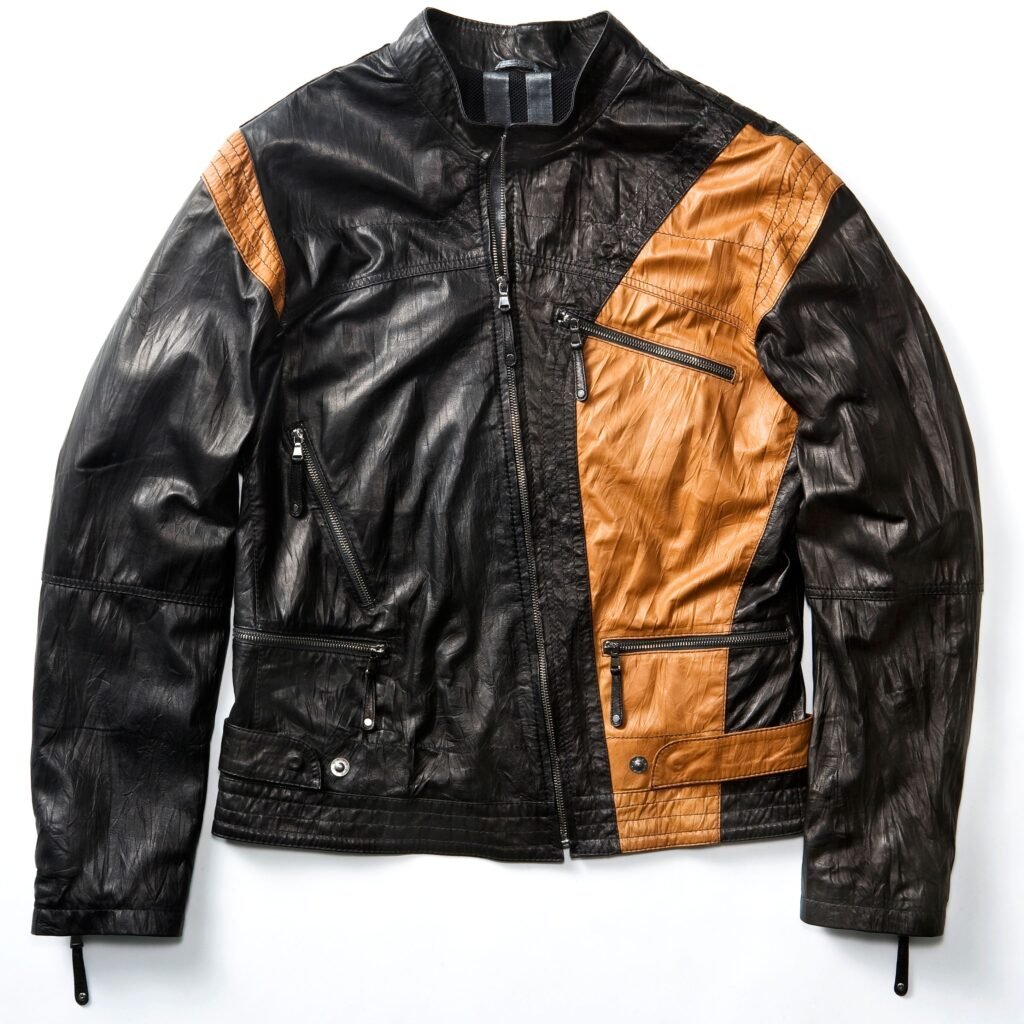 A stylish black and brown color-block leather jacket with multiple zippers and pockets. The jacket features black panels with tan-brown contrasting panels on the chest and sleeves, a front zip closure, and zipper pockets along the torso.