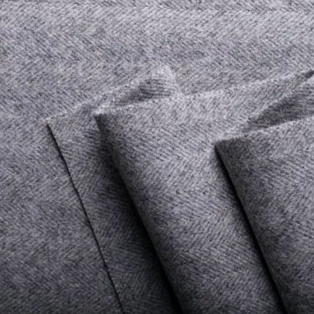 Close-up view of soft, textured fur in mixed brown and gray tones.Is Herringbone Wool Worth It?