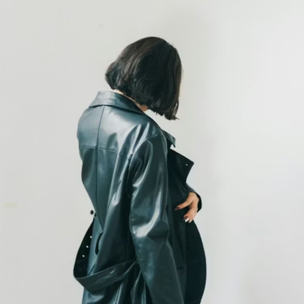 Stack of folded wool sweaters in rich winter colors, showcasing soft texture and cozy knit fabric.Lightweight Down Jacket