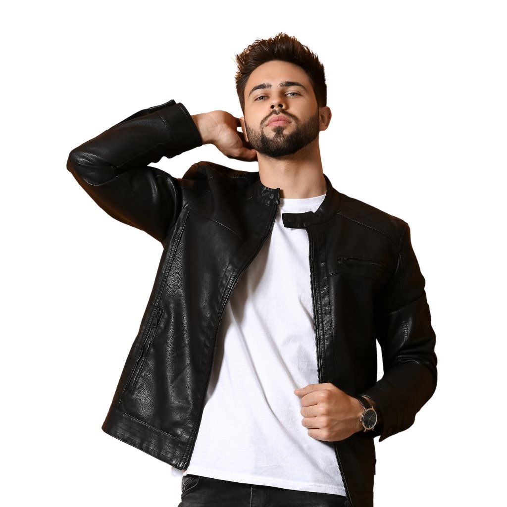 Leather Overshirt Jacket: A Modern Classic for All Seasons 7 A stylish man with a trimmed beard poses in a black leather jacket over a white T-shirt, looking confidently at the camera with one hand near his neck and the other adjusting his jacket.
