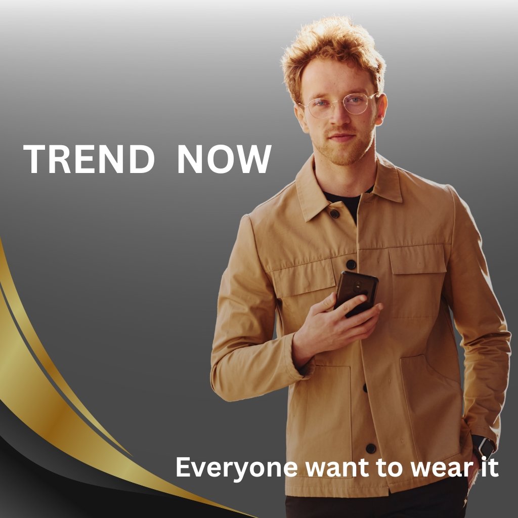A stylish man in a tan jacket holding a phone, standing against a gray gradient background with gold curved design. The text "TREND NOW" appears at the top left and "Everyone want to wear it" at the bottom right.
