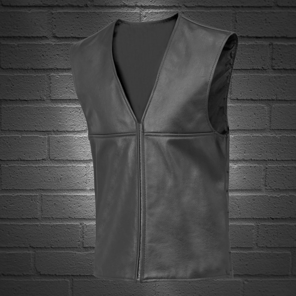 A sleeveless black leather vest with a front zipper, set against a dark brick wall background.