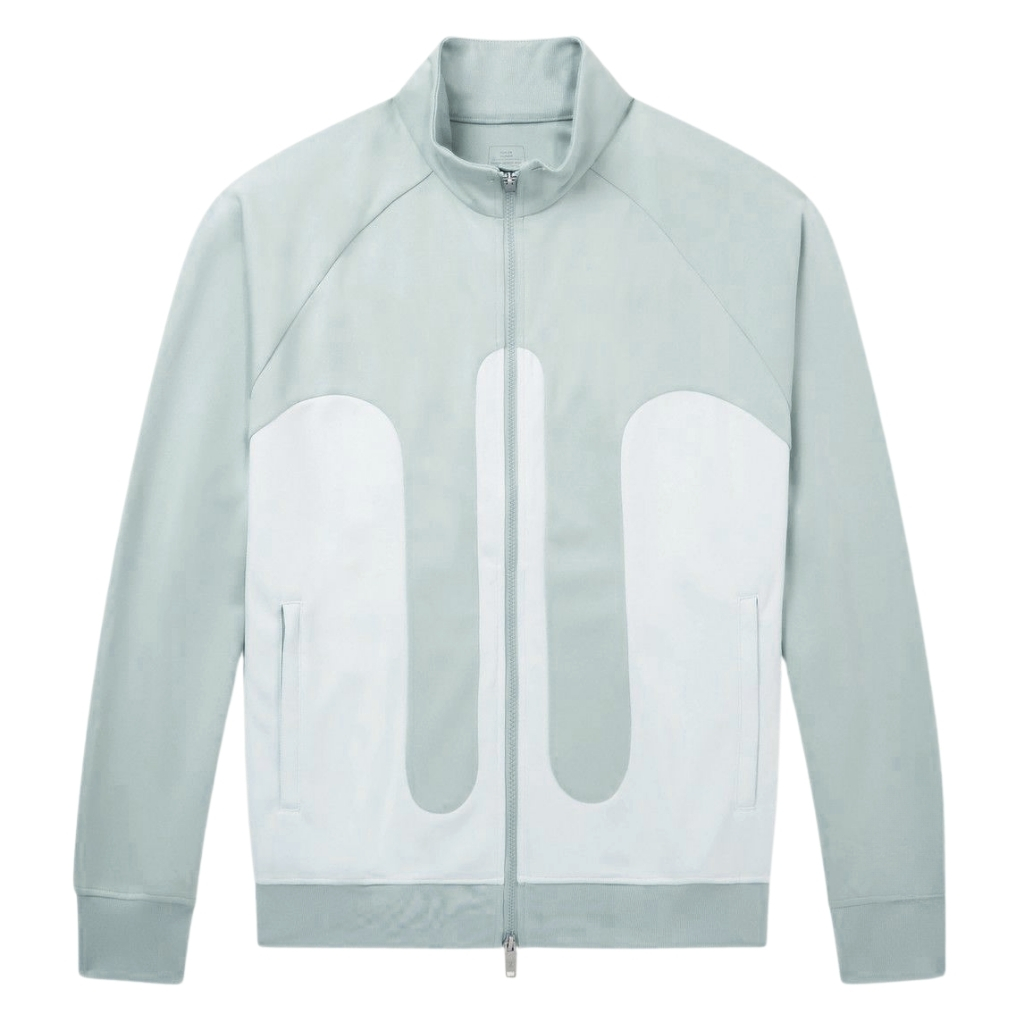 A light blue-green zip-up jacket with a high collar and large white abstract panels on the front, featuring long sleeves and ribbed cuffs and hem.