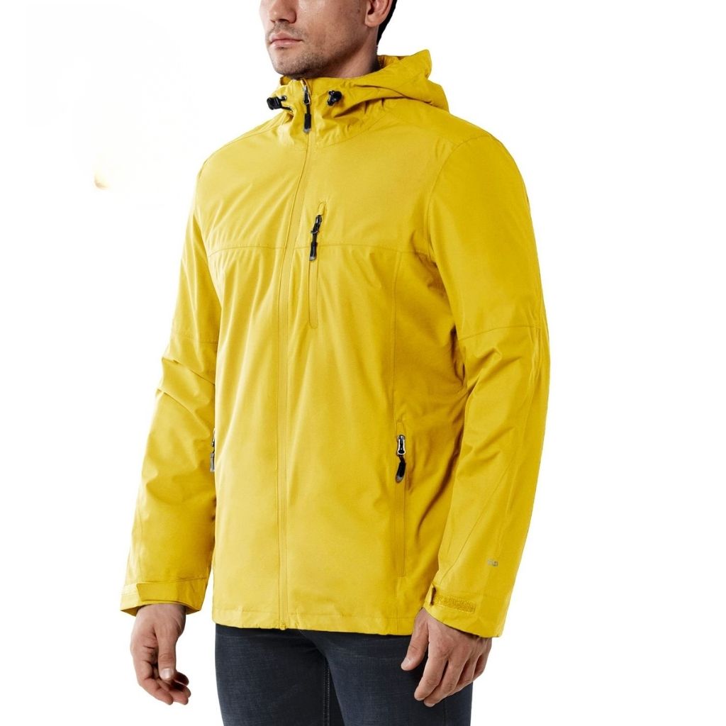 Man wearing a bright yellow storm jacket with a front zipper, high collar, and zippered pockets.