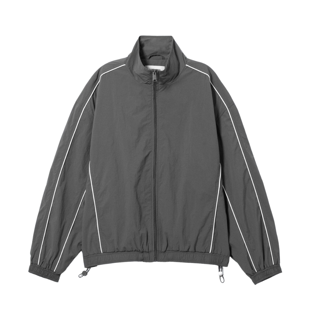 Gray windbreaker jacket with a full front zipper, white piping along the sleeves and shoulders, elastic cuffs, and a drawstring hem.