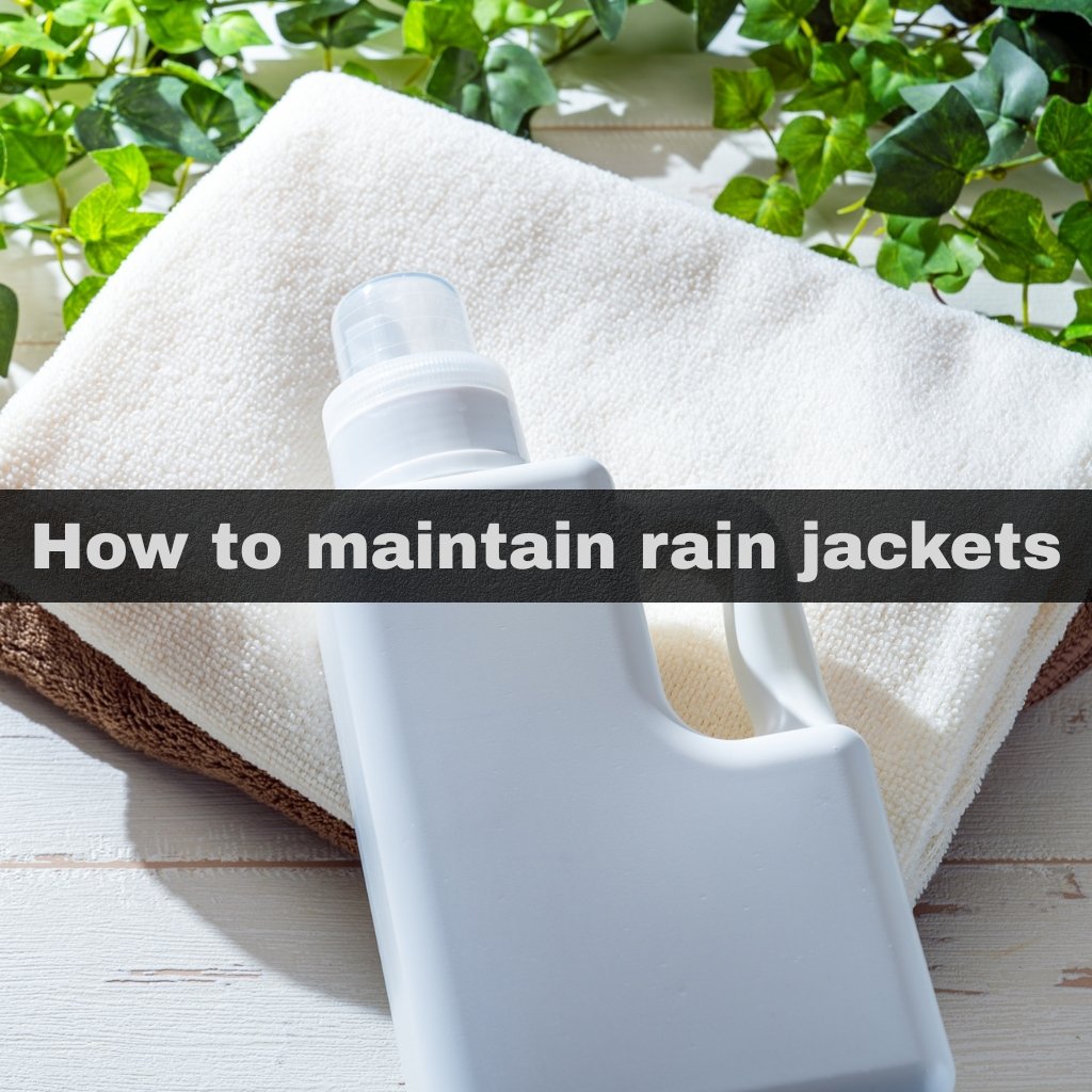 A white laundry detergent bottle resting on a folded beige towel, with green leafy plants in the background and a dark overlay reading How to maintain rain jackets.