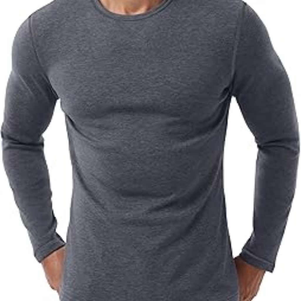 “Man wearing a dark gray long-sleeve crewneck shirt, shown from the waist up with hands in pockets.”Wool Thermal Fabric Explained: