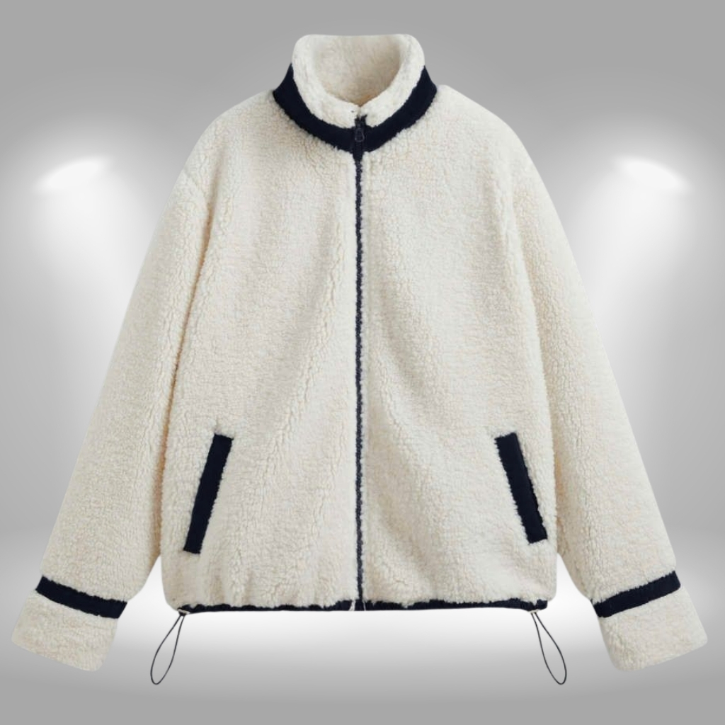 Cream-colored sherpa jacket with a black zipper and black trim along the collar, cuffs, and pockets. The jacket has a high collar, two angled front pockets, and adjustable drawstrings at the hem.