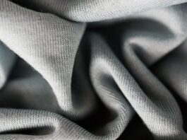 Organic Made Cashmere Wool Fabric A close-up view of soft, gray fabric folds and textures.Organic Made Cashmere Wool Fabric
