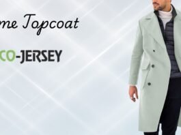 Man wearing a light green overcoat against a pale geometric background with the text ‘Prime Topcoat’ and the Eco-Jersey logo. Prime Topcoat