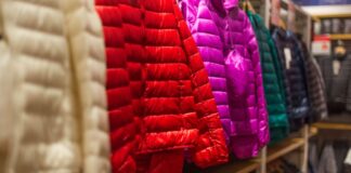 Boxy Fit Winter Jackets: The Ultimate Trend for Cozy Style Colorful quilted winter jackets hanging on a clothing rack in a retail store.Boxy Fit Winter Jackets