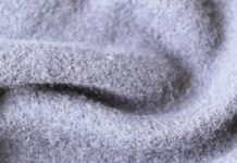 High-Density Wool Fabric: Why It’s Perfect for Cold Weather “Close-up photo of soft, light gray wool fabric with a fuzzy texture.” High-Density Wool Fabric: