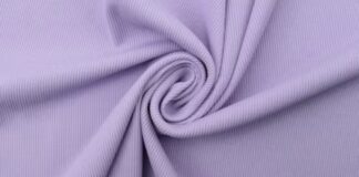 What Is Thermal Fabric? Features, Uses, and Buying Tips :“A close-up of soft lavender-purple fabric twisted into a gentle spiral fold.” What Is Thermal Fabric?