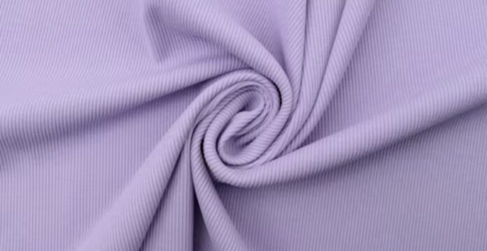 :“A close-up of soft lavender-purple fabric twisted into a gentle spiral fold.” What Is Thermal Fabric?