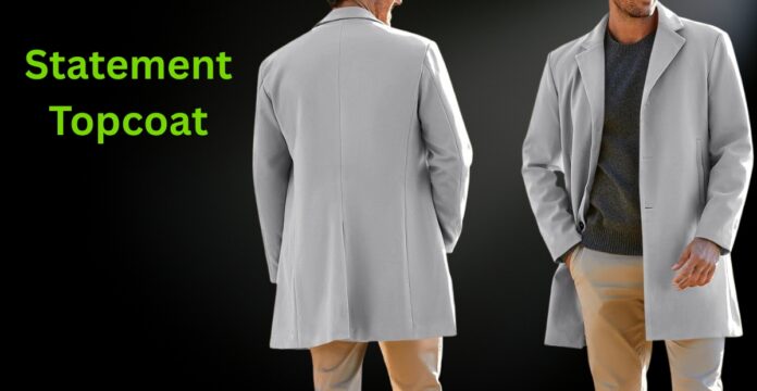 Two people wearing light gray overcoats against a dark background; one is shown from the back, the other facing forward with hands in pockets. Bright green text on the left reads 'Statement Topcoat'. Statement Topcoat