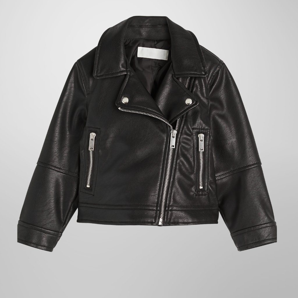 A cropped black leather biker jacket with silver zippers, lapel collar, and structured shoulders, displayed against a light gray background.How to Style a Leather Jacket