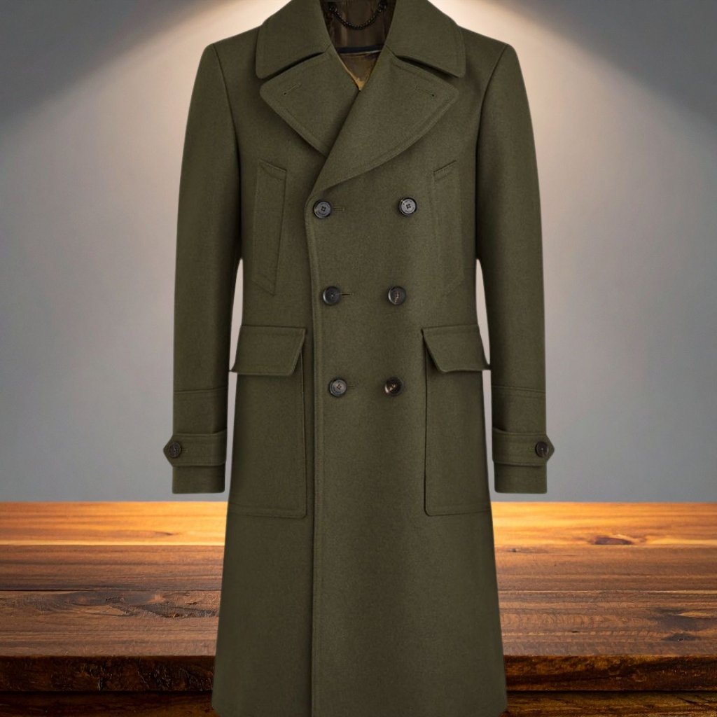 A long olive-green double-breasted wool coat displayed upright on a mannequin against a neutral background, with large lapels, pocket flaps, and buttoned cuffs.