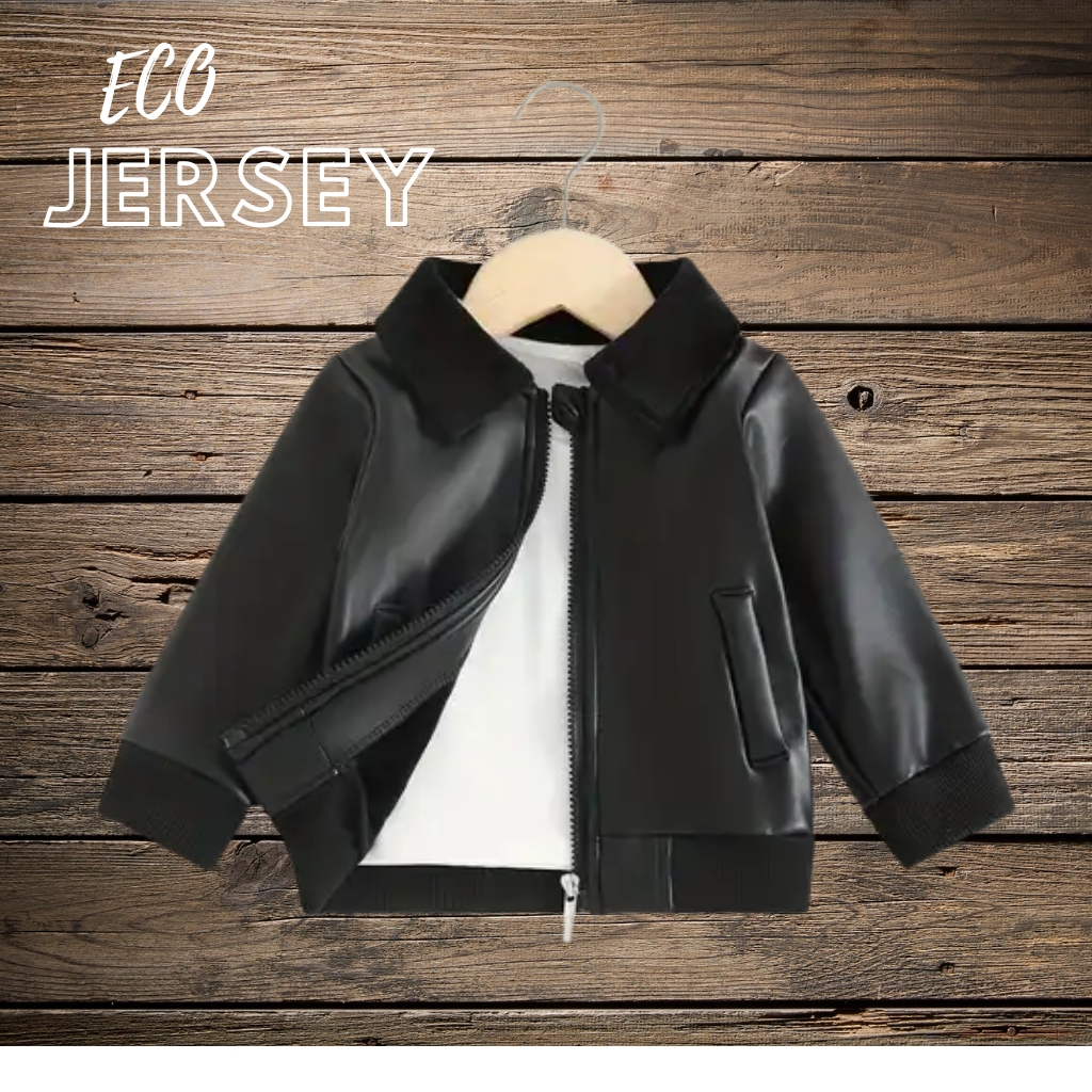 Soft Faux Leather Baby Jacket – Comfortable & Trendy Wear 2 Black faux leather baby jacket on a wooden hanger, partially unzipped to show white lining, with ribbed cuffs and a small front pocket. Soft Faux Leather Baby Jacket